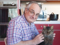 JS and Hermes the cat at kitchen table by Lisa 20  Little Buddy Guy and me.